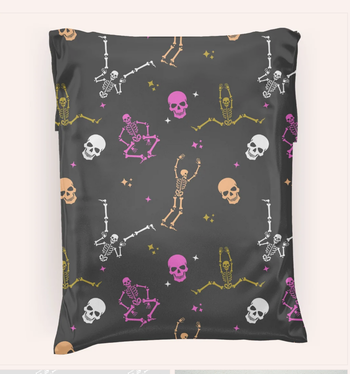 Charcoal polymailer with dancing skeletons, skulls, and starbursts in pink, white, olive green, and peach